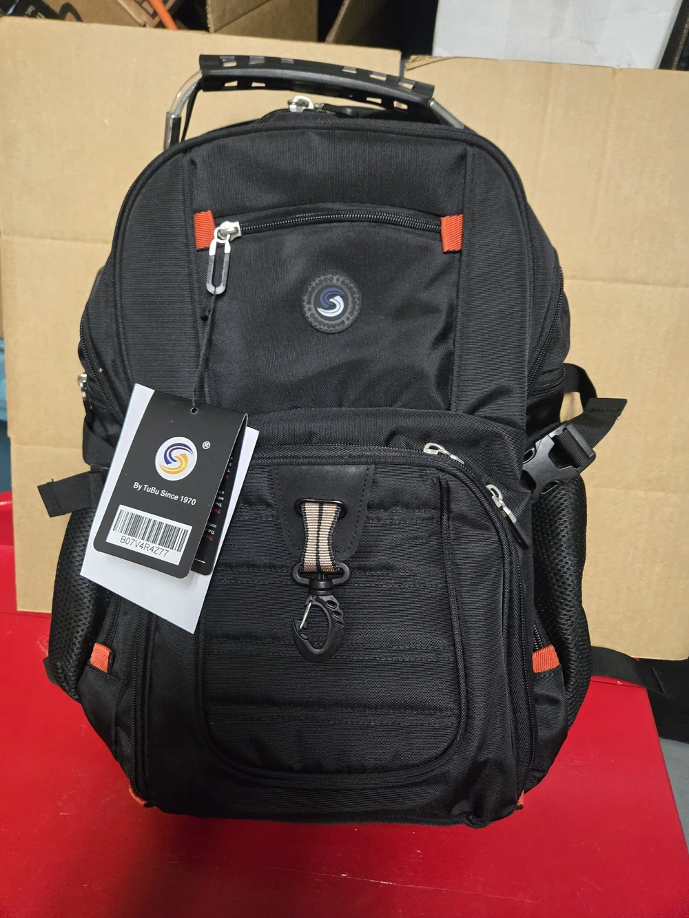 SHRRADOO travel backpack features vibrant red accents on the zippers and strap.
